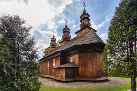 WISLOK WIELKI - MAY 29, 2020: Wooden Greek catholic church of St. Onuphrius (Onufry); Currently, a Roman Catholic church. in Wislok Wielki, Poland.のeditorial素材