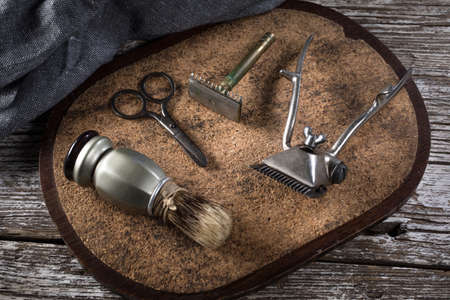 Vintage shaving and hair cutting tools. Selective focus.の写真素材
