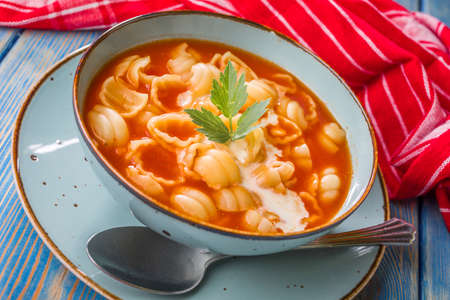 Fresh tomato soup with conchigliette in a bowl.の写真素材