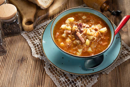 Traditional cabbage soup on wooden table.の写真素材