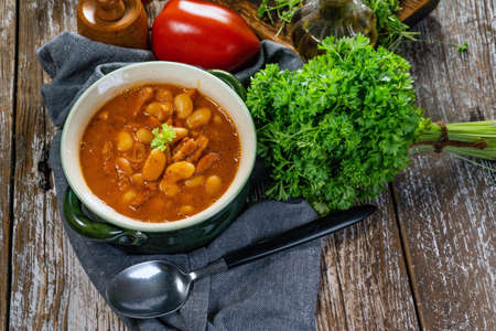 Baked beans in tomato sauce served in bowls.の写真素材