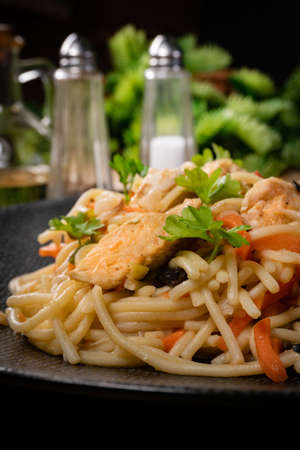 Fried noodles with chicken and vegetables. Chicken chow mein.の写真素材