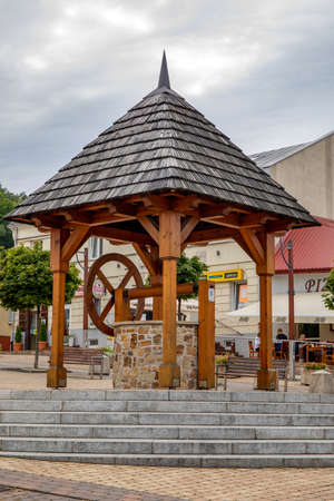 CHECINY, POLAND - SEPTEMBER 06, 2020: Historic well on the market of the old town.のeditorial素材