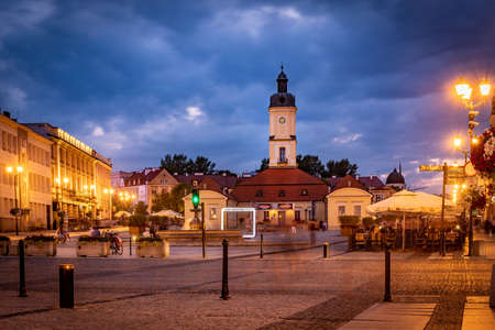 BIALYSTOK, POLAND - JULY 31, 2019: Kosciusko Main Square with Town Hall in Bialystok at night, Poland.のeditorial素材