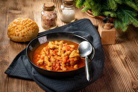 Tasty chicken fricassee in red pepper sauce.の写真素材