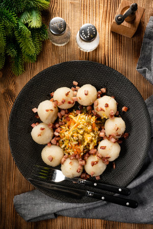 Meat stuffed potato dumplings with fried onion and greaves.の写真素材