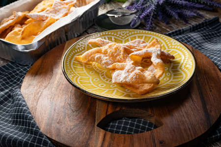 Faworki (angel wings) sprinkled with powdered sugar - traditional Polish carnival delicacyの写真素材