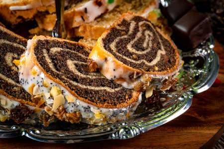 Various sweet cakes on a silver plate.の写真素材