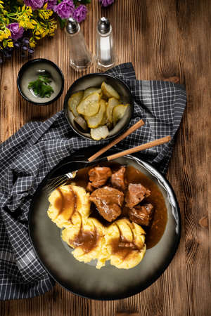 Stewed turkey meat served with sauce and mashed potatoes. Shallow depth of field.の写真素材