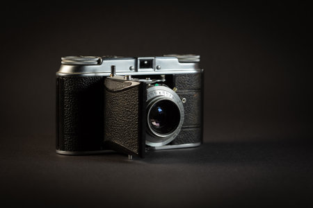 KATOWICE, POLAND - AUGUST 23, 2022: Voigtlander Vito II - vintage film camera on dark background.のeditorial素材