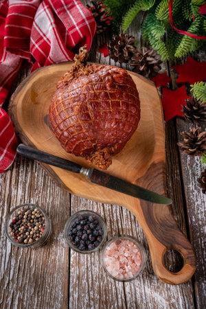 Baked ham on a cutting board. Shallow depth of field.の写真素材