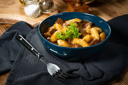 Beef stew in gravy, served with potato dumplings.