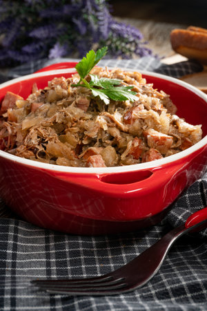 Bigos - sauerkraut stewed with meat, dried mushrooms and sausage. Traditional dish of polish cuisine.の写真素材