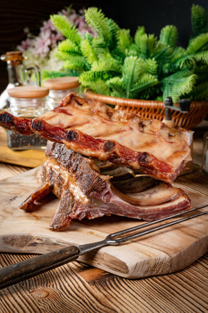 Smoked pork bone on wooden cutting board.の写真素材