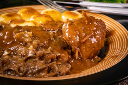 Beef roulade served with silesian noodles and fried cabbage.の写真素材