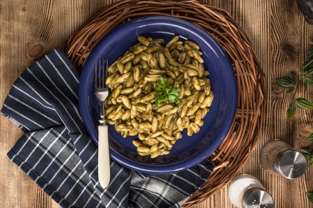 Cavatelli pasta with fresh spinach sauce. Italian cuisine.の写真素材