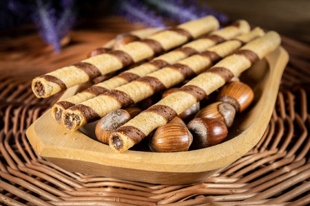 Sweet spiral tubes with nuts cream. Selective focus.の写真素材