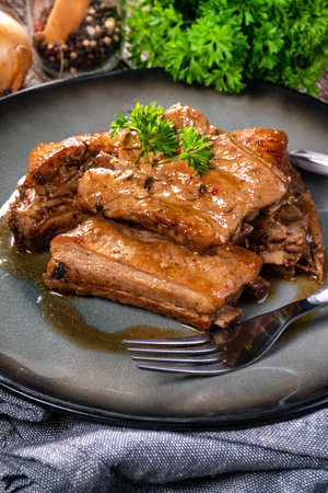 Braised pork spare ribs served on a plate.の写真素材