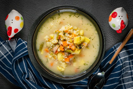 Bowl of delicious vegetable soup on a tableの写真素材