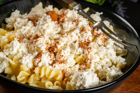 Pasta with cottage cheese, cinnamon and sugar. Shallow depth of field.の写真素材