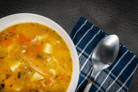 Polish barley soup with vegetables and chicken - krupnik.の写真素材