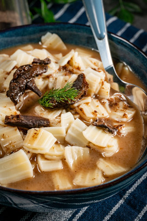 Mushrooms soup with noodles. Shallow depth of field.の写真素材