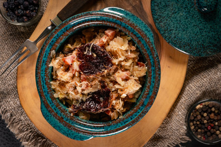 Stewed cabbage with pork, sausages and mushrooms. Bigos - traditional Polish cuisine. Top view.の写真素材