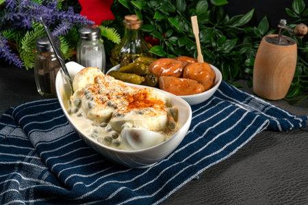 Boiled halvese egg with mayonnaise and green peas.