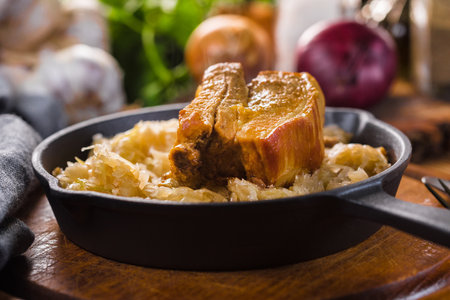 Traditional spare ribs baked in Sauerkraut. Selective focus.の写真素材