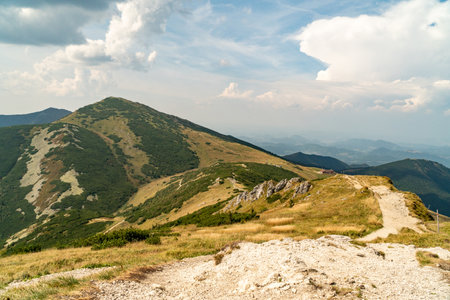 Hiking trail overlooking the mountain peaks of the hills.の写真素材