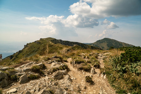 Hiking trail overlooking the mountain peaks of the hills.の写真素材
