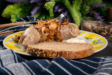 Fried white sausage with onion and grated horseradish. Small depth of field.の写真素材