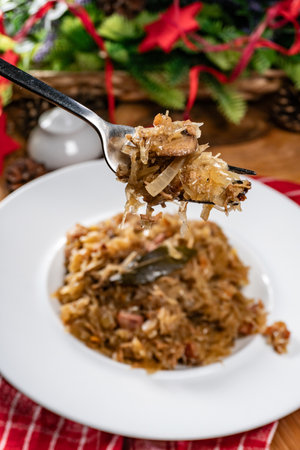 Stewed cabbage with pork, sausages and mushrooms. Bigos - traditional Polish cuisine.