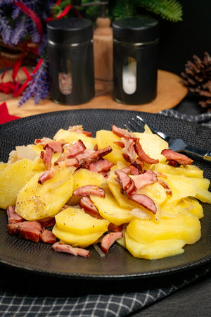 Stewed potatoes with smoked bacon, sausage and onion. A traditional Polish dish.の写真素材