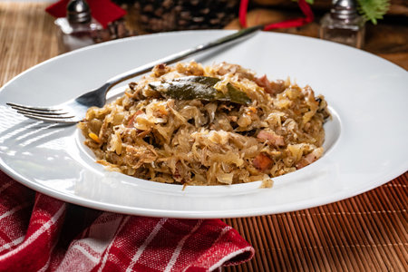 Stewed cabbage with pork, sausages and mushrooms. Bigos - traditional Polish cuisine.