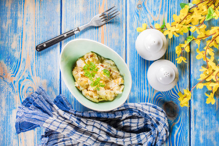Scrambled eggs with onion served in bowl. Top view.の写真素材