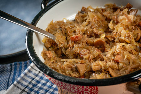 Stewed cabbage with pork, sausages and mushrooms. Bigos - traditional Polish cuisine.の写真素材