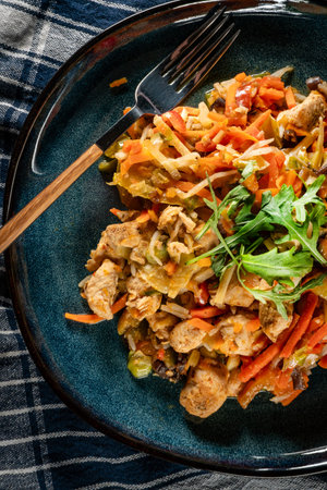 Fried chicken pieces with vegetables on plate.の写真素材