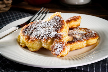 Sweet pancakes made of apple, milk and flour (pancakes).