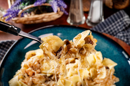 Pasta with sauerkraut and mushrooms. Laszanki - a tasty dish of traditional Polish cuisine.の写真素材
