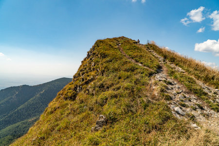 Hiking trail overlooking the mountain peaks of the hills.の写真素材