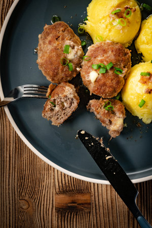 Meatballs served with boiled potatoes on a plate. Top view.の写真素材