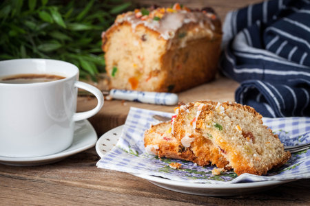 Traditional Christmas cake with candied fruit, raisins and fruits. Selective focus.