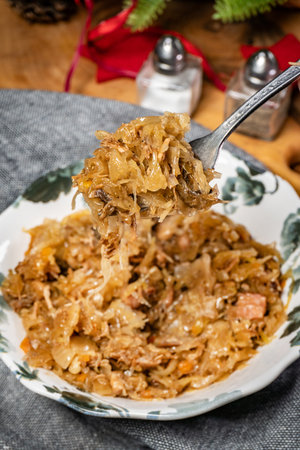Stewed cabbage with pork, sausages and mushrooms. Bigos - traditional Polish cuisine.