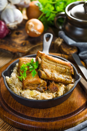 Traditional spare ribs baked in Sauerkraut. Selective focus.の写真素材