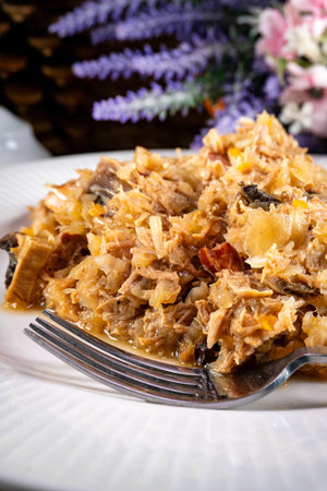 Stewed cabbage with pork, sausages and mushrooms. Bigos - traditional Polish cuisine.