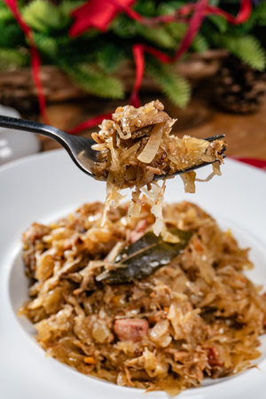 Stewed cabbage with pork, sausages and mushrooms. Bigos - traditional Polish cuisine.