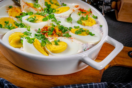 Boiled eggs decorated with green onion.