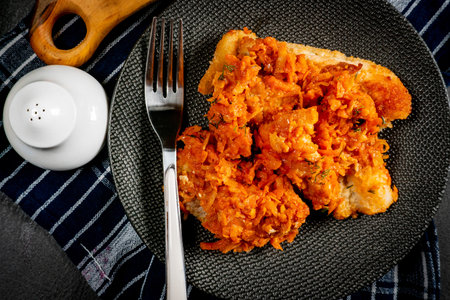 Fish in Greek kind with vegetables and tomato sauce. Shallow depth of field.の写真素材