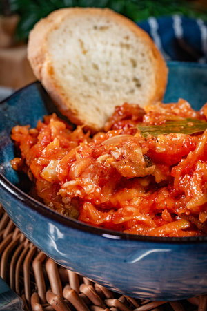 Homemade fish stew with vegetables in spicy tomato sauce.の写真素材